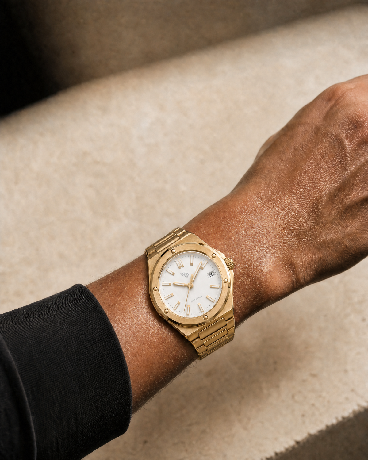 Facet 01 — Gold / Ivory watch shown on wrist.