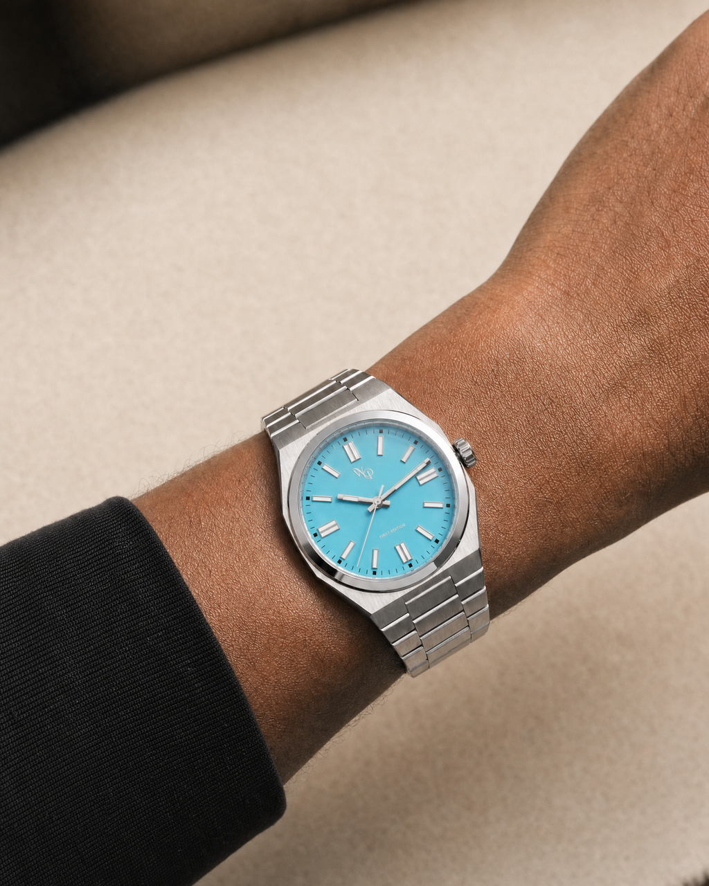 Vale 03 — Steel / Cyan watch shown on wrist.