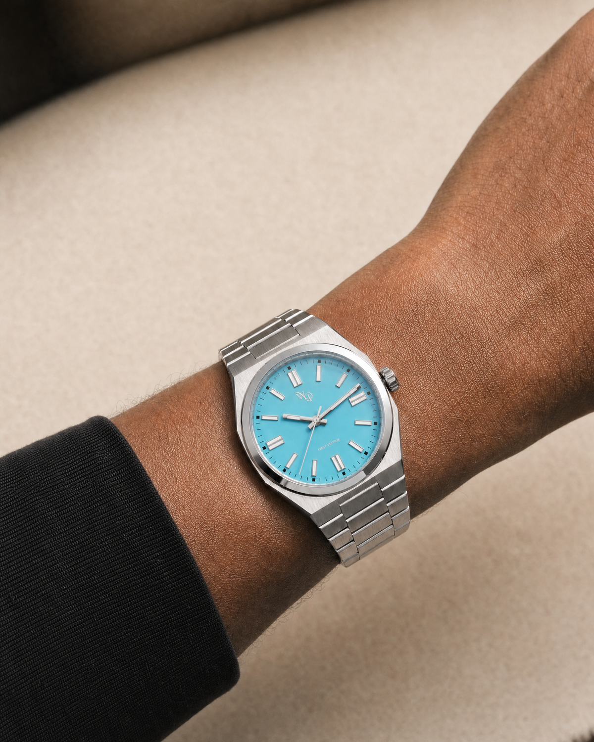 Vale 03 — Steel / Cyan watch shown on wrist.