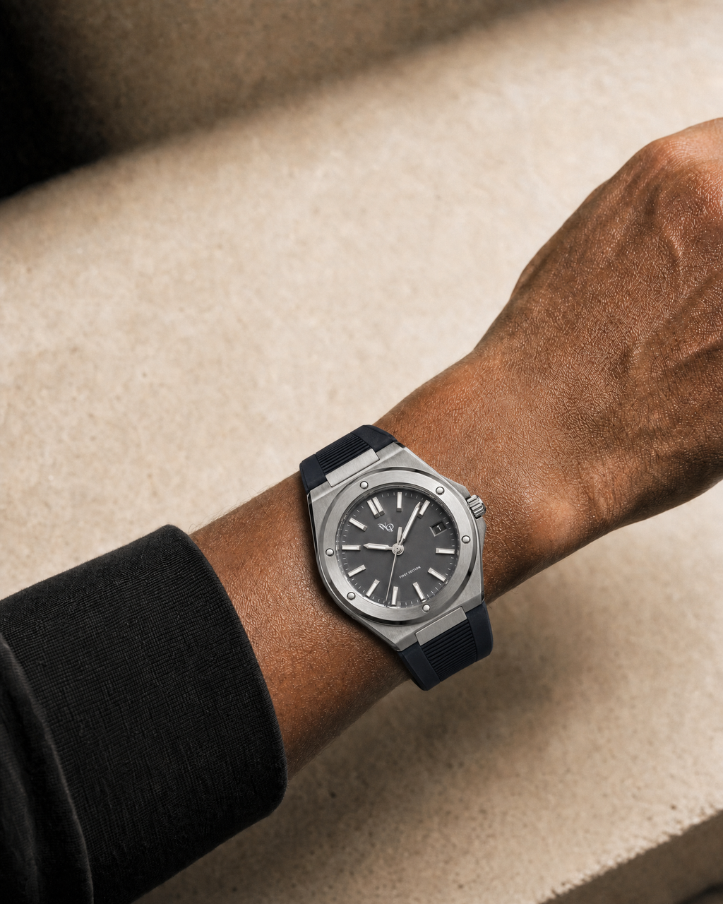 Facet 01 — Slate / Charcoal watch shown on wrist.