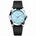 WP-DRAFT-1603 only — ice blue round-date watch with smooth black strap; branded front study. Silver WP and FIRST EDITION; production proof pending.