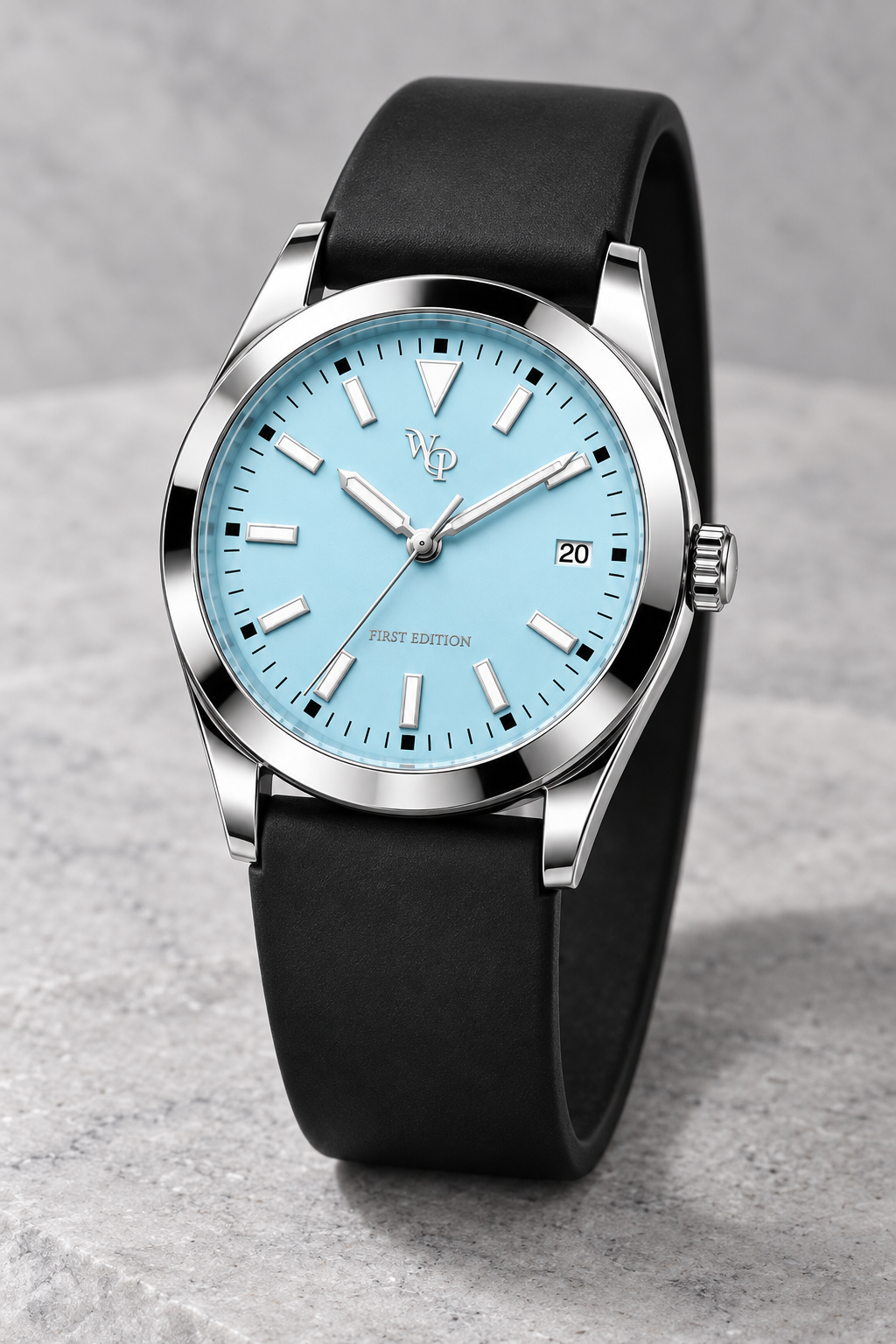 WP-DRAFT-1603 only — ice blue round-date watch with smooth black strap; full oblique study. Silver WP and FIRST EDITION; production proof pending.