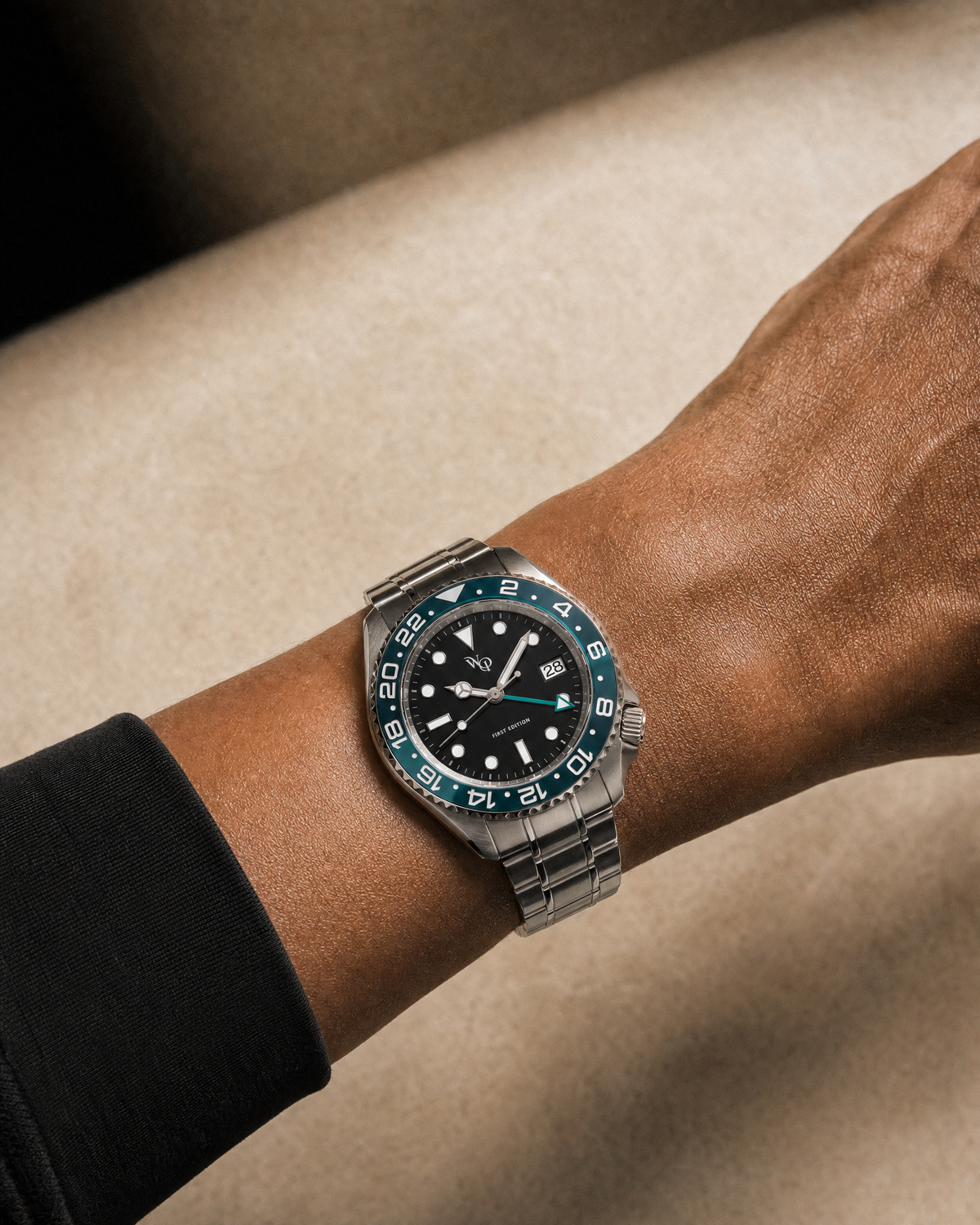 Meridian 04 — Steel / Teal watch shown on wrist.